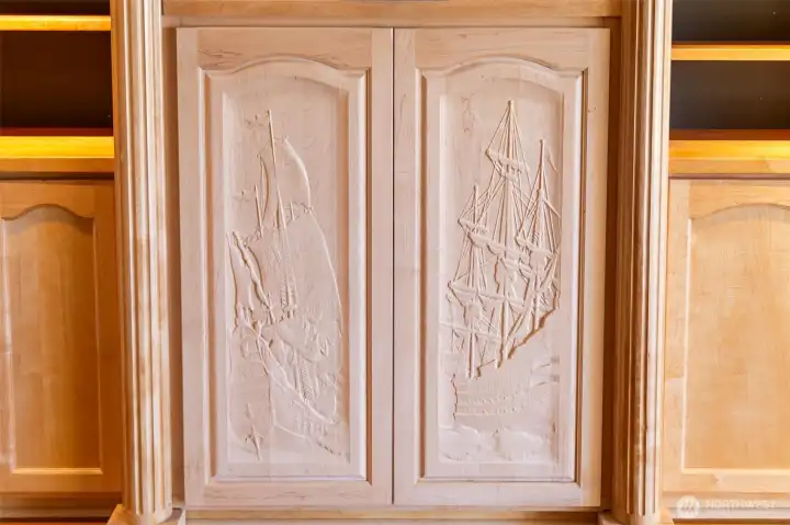 Custom carved cabinet in Bonus Room.