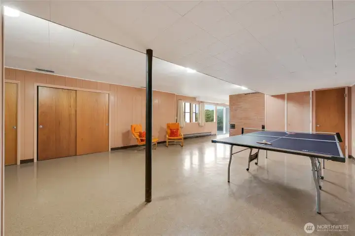 A bright and spacious second entertainment area on the lower level, perfect for ping-pong battles, game nights, or casual hangouts. With plenty of room to play and relax, it’s an ideal spot for fun, laughter, and making memories.