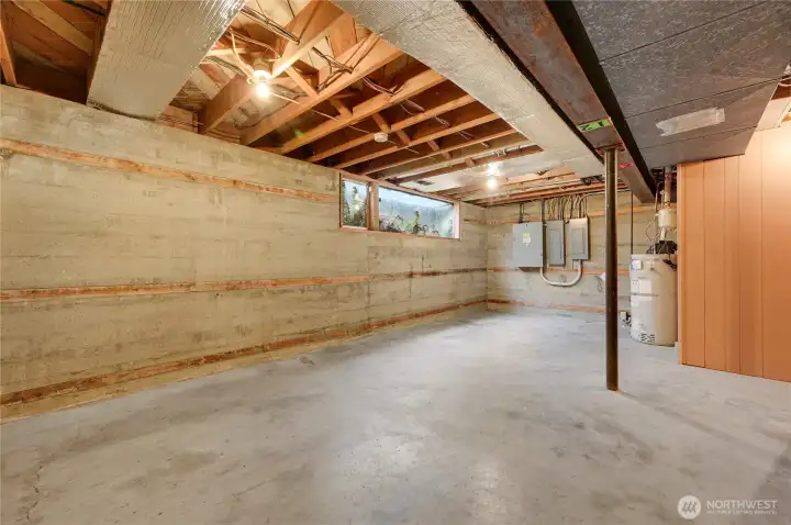 Spacious 700 sq ft unfinished basement with high ceilings—ideal for storage, future expansion, or creating additional living space. Clean, open layout with utilities conveniently located and ample natural light from a full-size window.