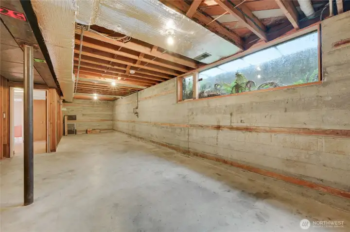 Spacious 700 sq ft unfinished basement with high ceilings—ideal for storage, future expansion, or creating additional living space. Clean, open layout with utilities conveniently located and ample natural light from a full-size window.