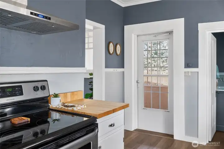 Kitchen with entrance to sun room and full bath
