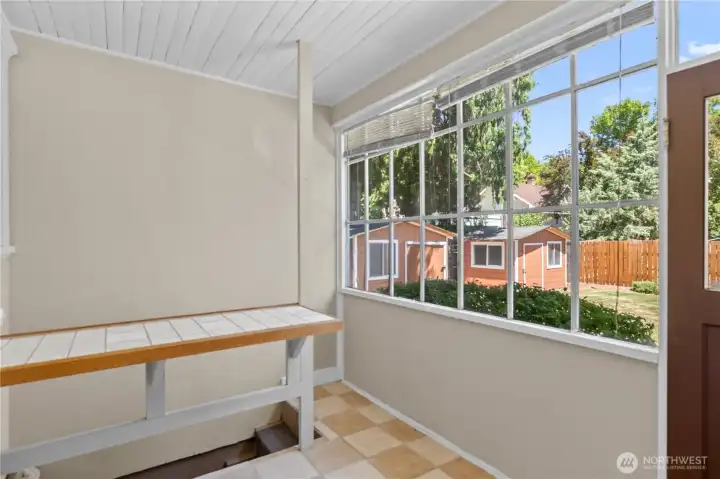 Sunroom off kitchen with basement access
