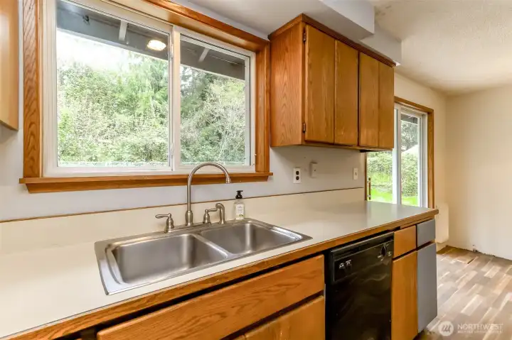Kitchen window looks into the back yard.