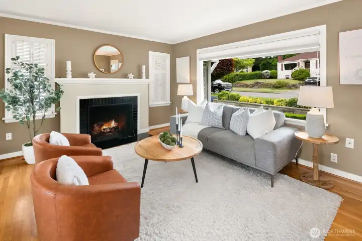 Cozy gas fireplace and original shutter windows.