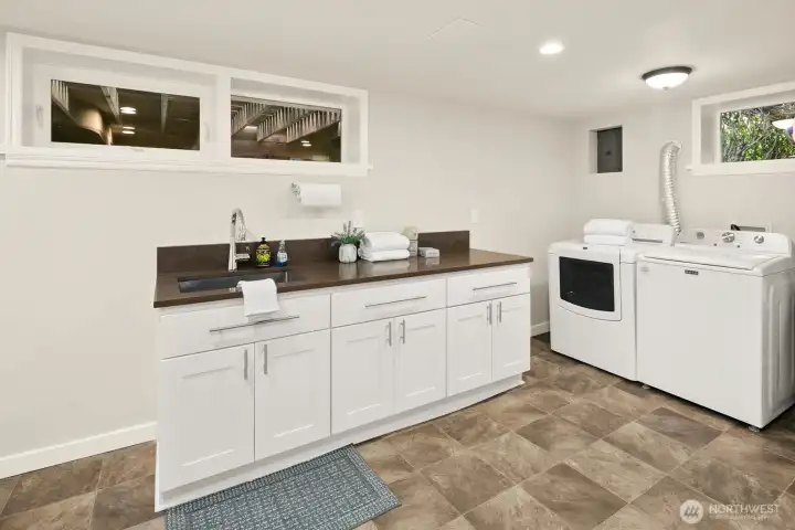 Large utility room with sink and good counter space.