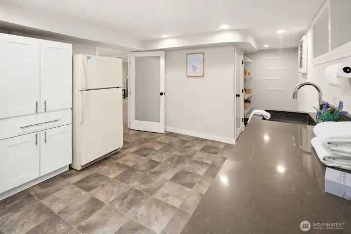 More storage cabinets and extra fridge.
