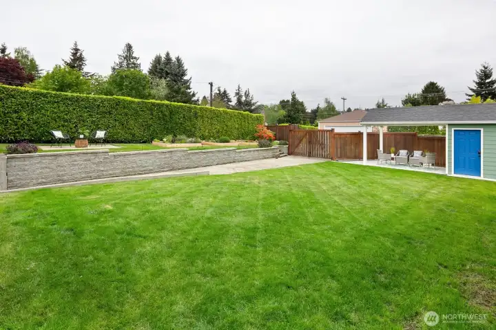 Beautiful large corner lot.  Gated entry from back alley.