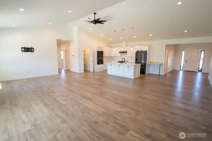 Front entry door to the right, Primary and two guest bedrooms to the left