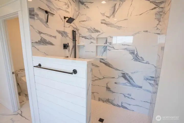Deluxe tile shower in the primary bathroom