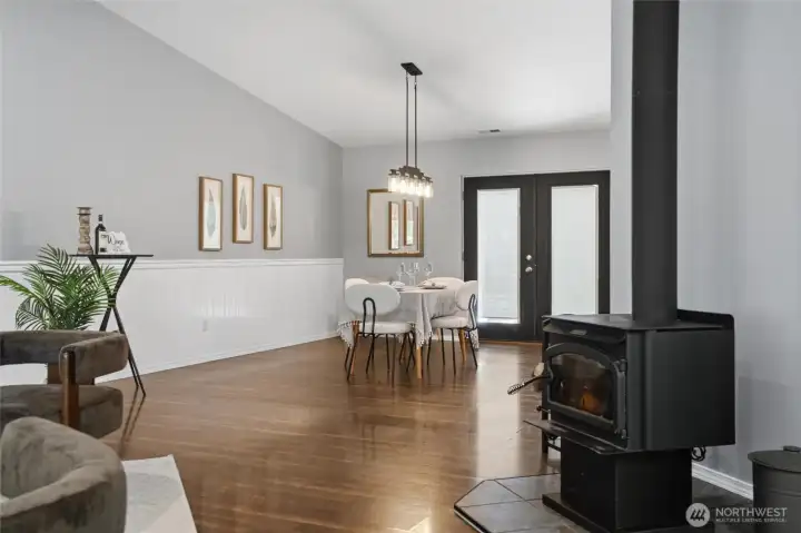 Looking into dining room with french doors to backyard