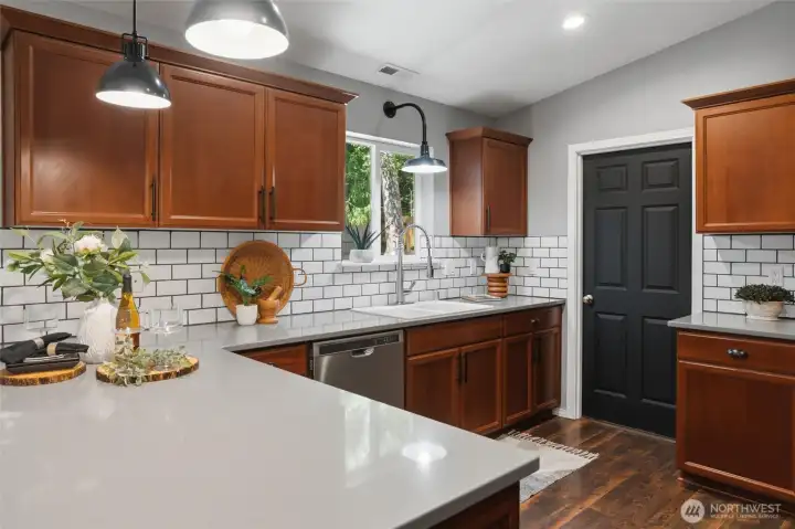 Kitchen looking towards large pantry with full size freezer inside