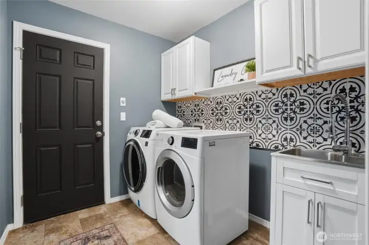 Laundry room with access to backyard