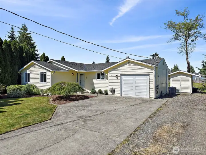 Plenty of parking for all your toys- RV, boat, guests parking and more! The storage shed in the back offers a place to tuck the unwanted garage items out of the way too-NO HOA!