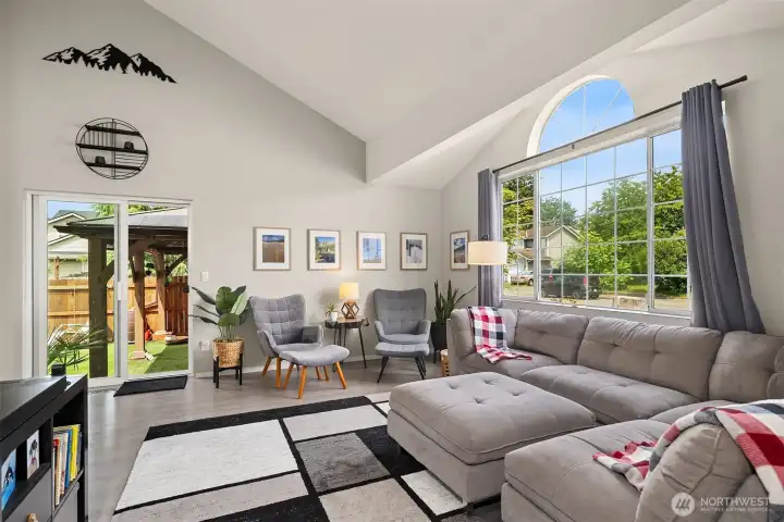 Living room with huge east facing window. Lots of natural light.