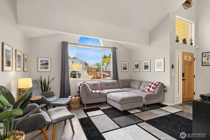 Living room with huge east facing window. Lots of natural light.