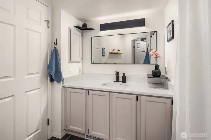 Primary bath with remodeled vanity.