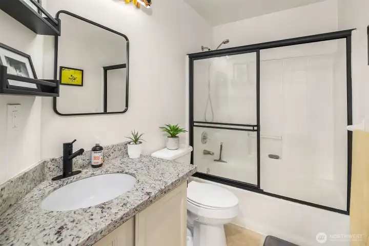Remodeled upper hall full bath.