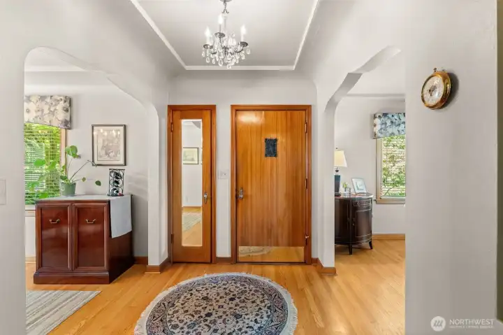 This beautiful entryway features a stunning wooden door and gleaming hardwood floors that invite you right inside. This beautiful entryway features a stunning wooden door and gleaming hardwood floors that invite you right inside.