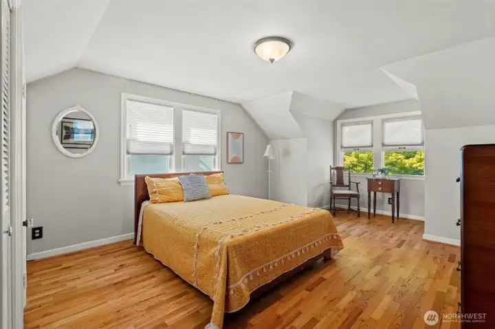 This lovely secondary bedroom continues the home’s warm and inviting theme. Generous closet space and large windows make it a peaceful retreat for family or visitors alike. This lovely secondary bedroom continues the home’s warm and inviting theme. Generous closet space and large windows make it a peaceful retreat for family or visitors alike.