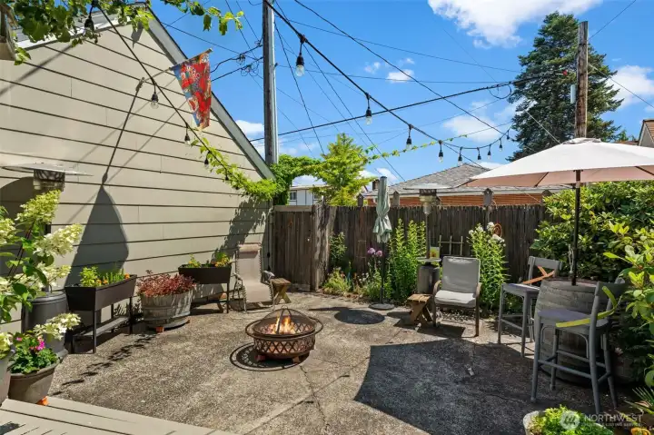 This expansive patio is a true evening showstopper, illuminated by charming string lights. This expansive patio is a true evening showstopper, illuminated by charming string lights.