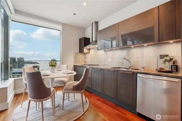 Kitchen & dining nook overlooking the city. Virtually Staged.