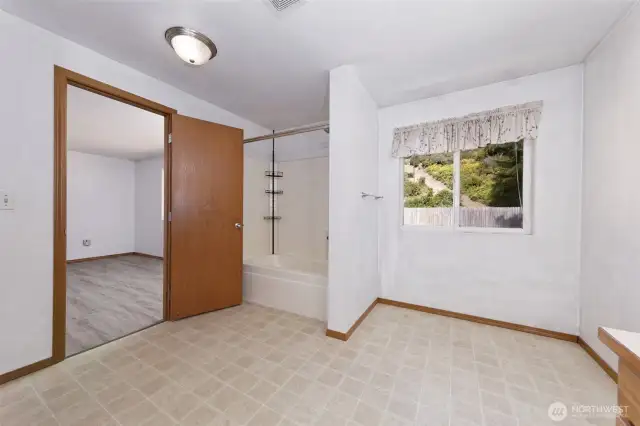 Primary bath with space to add extra storage or vanity space.