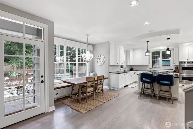 Kitchen is complete with island and build-in dining nook