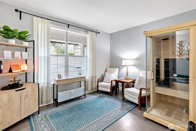 Mainfloor office is graced with French doors.  Currently being used as a sauna room for ultimate relaxation