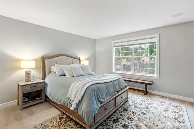 Luxurious primary suite with sitting area, 5-piece bath and large walk-in closet