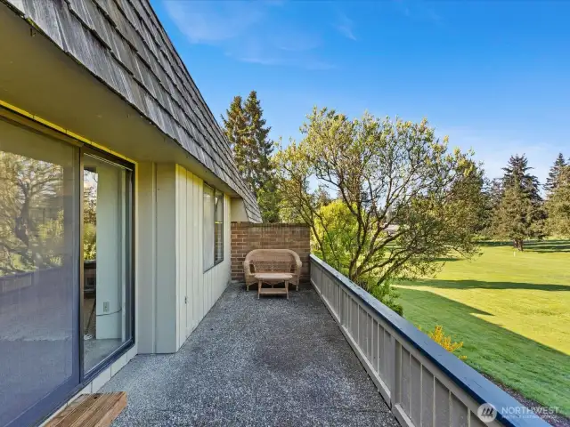 Your large back deck overlooks the golf course.