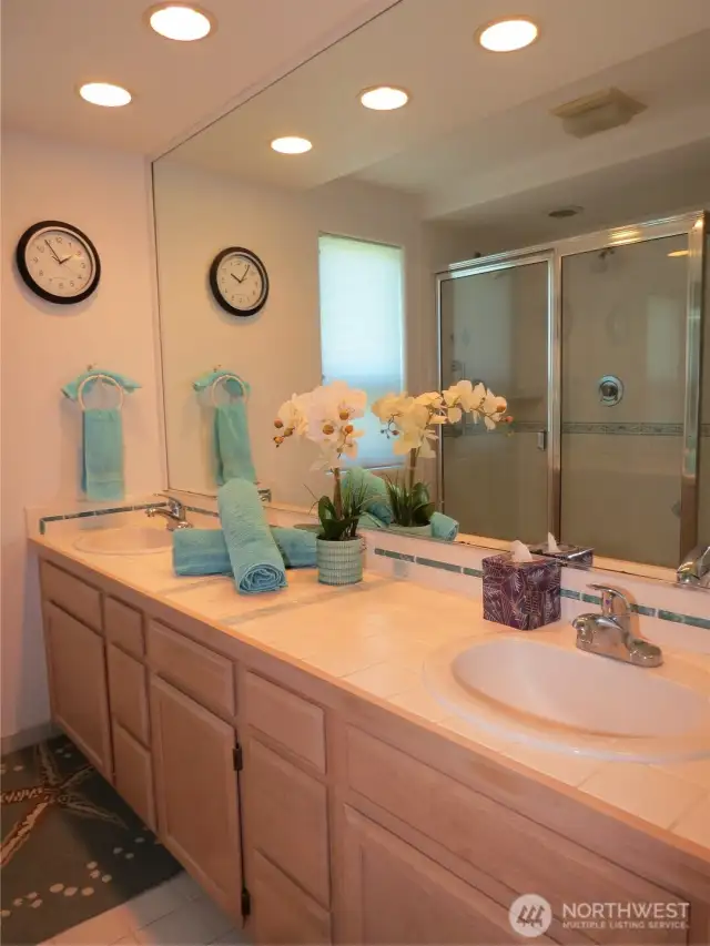 THE ATTACHED PRIMARY BATH HAS DOUBLE SINKS, LARGE MIRROR AND GORGEOUS VANITY!