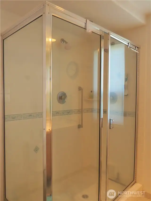 PRIMARY BATH HAS A FULL SIZE GLASS SURROUND SHOWER!