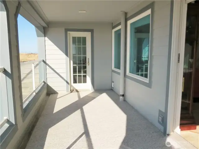 THE DECK IS THE FULL LENGTH OF THE CONDO FOR MULTIPLE GUEST SEATING TO WATCH THE WHALES AND WILDLIFE MIGRATING!  THE DOOR AT THE END IS A WET BAR!