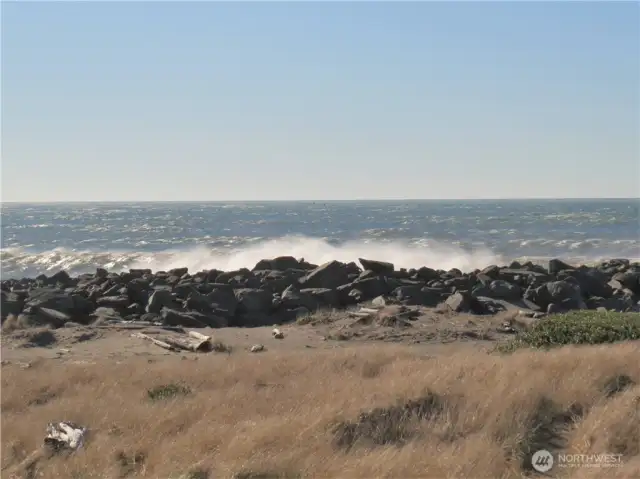 SIT ON YOUR COVERED DECK AND WATCH WAVES ALONG THE ROCK JETTY!
