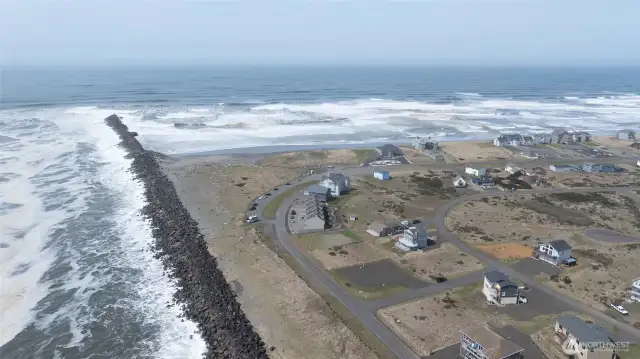 THIS DRONE PICTURE SHOWS THE SIDE VIEW OF THE CONDO OUT TOWARDS THE BAR AND PACIFIC OCEAN VIEWS!