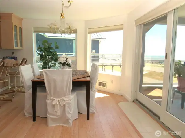 DINING ROOM HAS BAMBOO FLOORING & SWEEPING VIEWS OF THE OCEAN & JETTY!