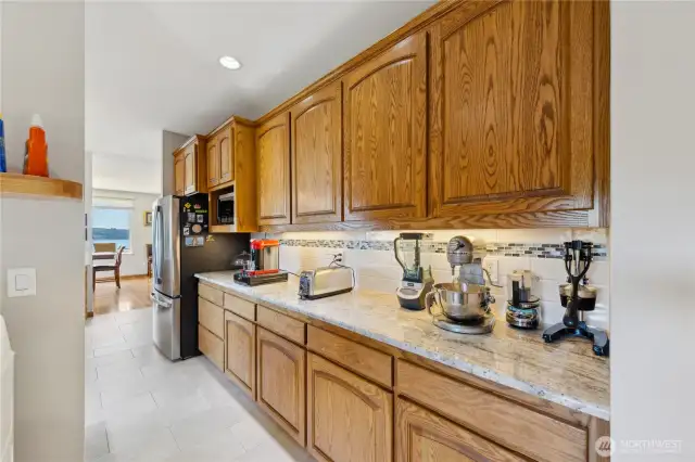 Here is the Butler's Pantry space with extra storage drawers and cabinets.  This space is perfect for a Baker to roll dough on that Granite slab!