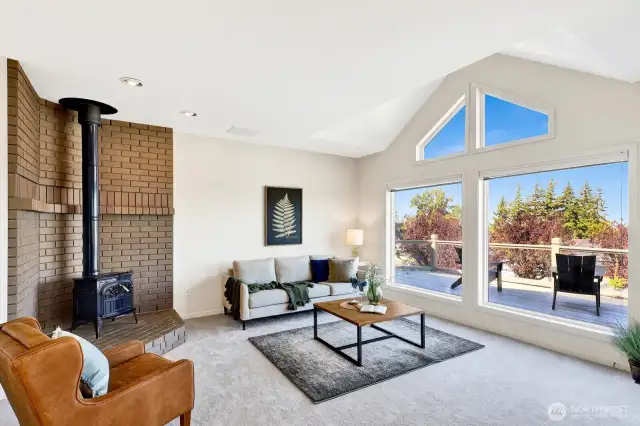 Family room is open to the kitchen and features a wood burning stove