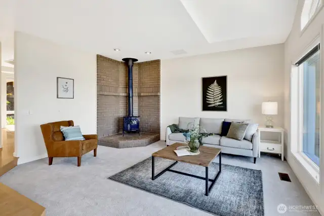 Family room features a wood stove
