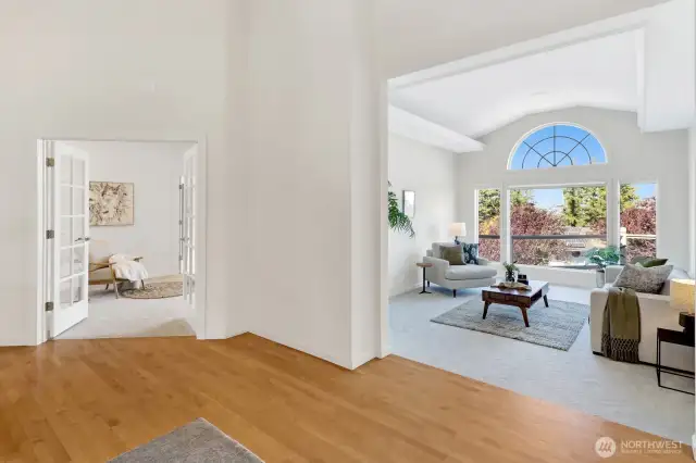 View of the great room and primary bedroom from the entryway