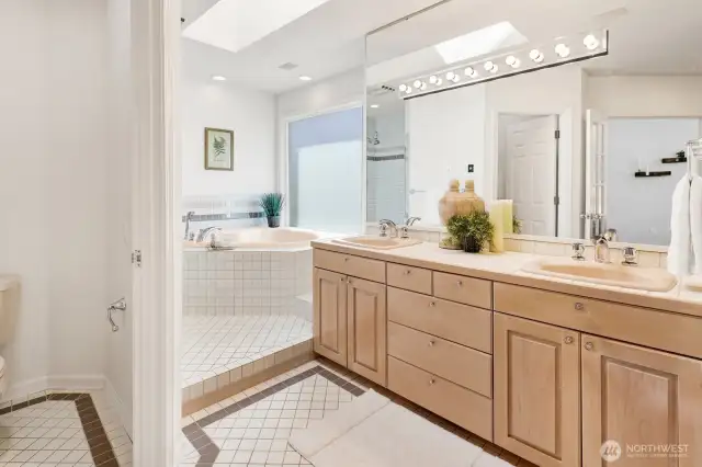 The main level primary bath is large and has a great layout with private toilet area, jetted tub, oversized shower, and double-sinks