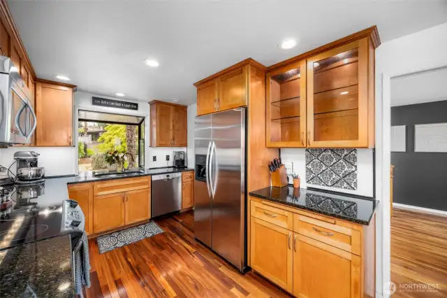 Chef's kitchen. Cherry shaker cabinetry. Black granite.