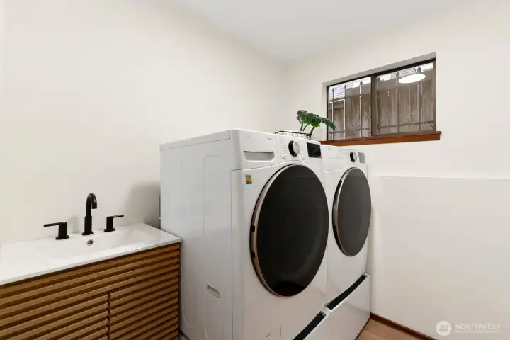 Laundry with new washer/dyer and sink
