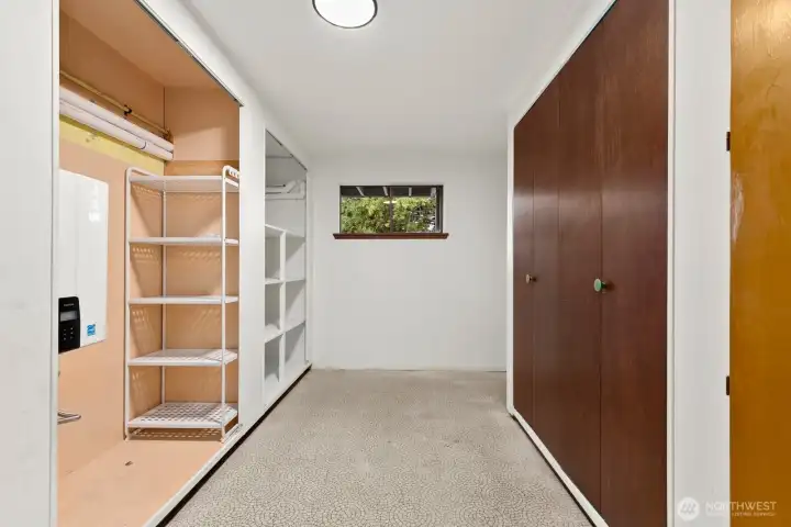 Extra storage room where the tankless water heater and furnace is located
