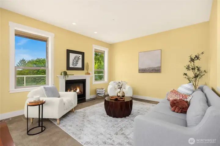 Cozy living room off of kitchen with gas fireplace.