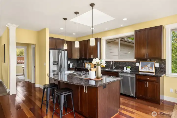 Stunning chef's kitchen with slab granite countertops, SS appliances and water views.