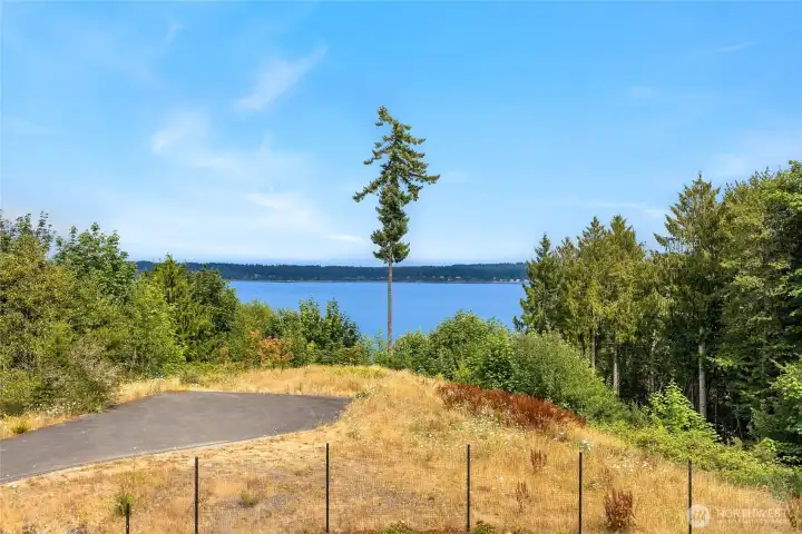 High-bank waterfront buildable lot. 1.55 acres. Separate tax parcel and not included in this sale.