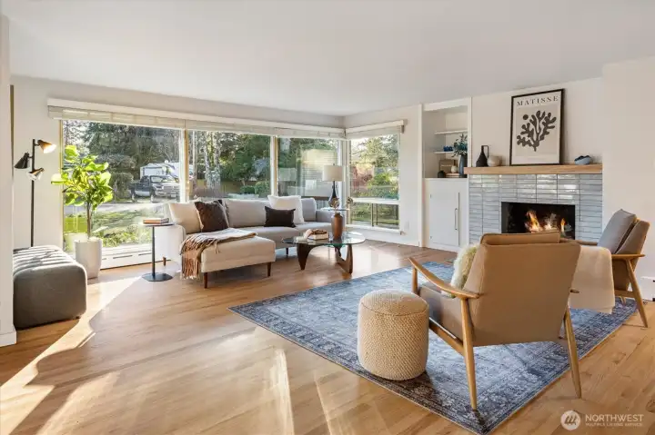 This large living room has recently refinished hardwood floors and cozy wood burning fireplace.