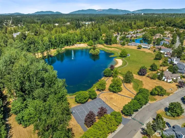 Photo of the neighborhood park (summer). The HOA stock the lakew with the fish in the Spring so the neighborhood can fish. You can also launch a kayak or canoe at the beach!