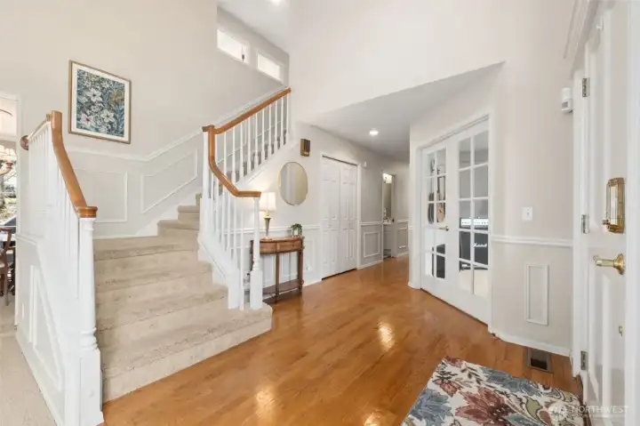 Stepping in you can see the main floor office on the right, and one (of two) staircases leading upstairs and the hardwoods.